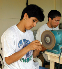 An artisan works diligently to finish a piece, Pontare, Ecuador